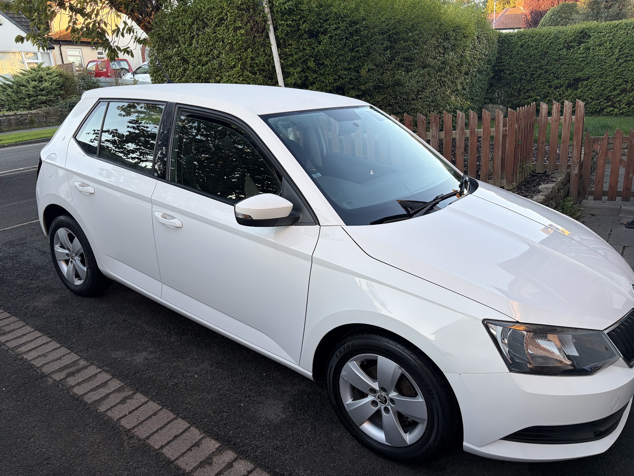 White Skoda photographed outside after a valet